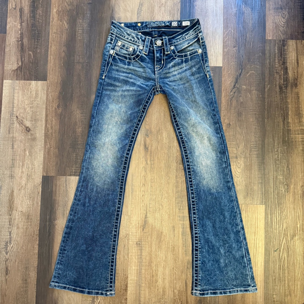 Miss me girls size 10 flared jeans with star horse shoe emblem.